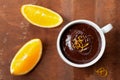 Delicious dessert from dark chocolate mousse with orange slice decorated citrus peel Royalty Free Stock Photo