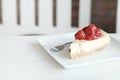 Delicious with dessert a piece of cherry cheesecake on white tone wooden table Royalty Free Stock Photo