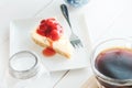 Delicious with dessert a piece of cherry cheesecake on white tone wooden table Royalty Free Stock Photo