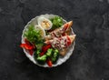 Delicious diet lunch, breakfast - boiled egg, fresh vegetable salad, broccoli and hot sandwiches with tomato and cheese on a dark Royalty Free Stock Photo