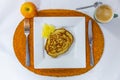 Delicious dietary breakfast of a pancake with pineapple, an apple, coffee, served