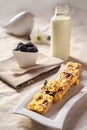 Delicious dietary low-calorie cookies with berries, bottle of milk and blackberries on natural color tablecloth and home