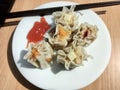 Delicious dimsum with tomoto sauce on the plate