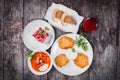 Delicious dinner table with potato pancakes, traditional beetroot soup - borscht with beef, beet salad Vinaigrette, Royalty Free Stock Photo