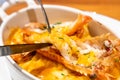 The delicious dish named Langoustine gratin. Langoustines look similar to miniature lobsters, and this creamy gratin is elevated i Royalty Free Stock Photo