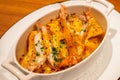 The delicious dish named Langoustine gratin. Langoustines look similar to miniature lobsters, and this creamy gratin is elevated . Royalty Free Stock Photo