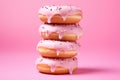 Delicious donuts on a pink background