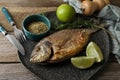 Delicious dorado fish served on wooden table
