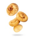 Delicious dried figs in the air closeup on a white background Royalty Free Stock Photo