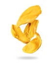 Delicious dried mango in the air closeup isolated on a white background Royalty Free Stock Photo