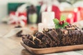 Delicious dried mixed nut Christmas fruit cake on wooden plate