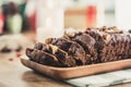 Delicious dried mixed nut Christmas fruit cake on wooden plate Royalty Free Stock Photo