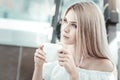 Attractive young woman having coffee Royalty Free Stock Photo