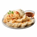 Delicious Dumplings With Dipping Sauce On A Plate