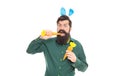 Delicious Easter treats. eastertide. happy bearded man wear bunny ears. happy easter carrot. Royalty Free Stock Photo