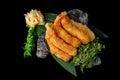 Delicious Ebi Sashimi Sweet Shrimp, Prawns with carrot, cucumber, nori, lemon on black background. Royalty Free Stock Photo