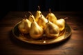 Delicious eco organic golden pear fruits with water drops in plate on wooden table