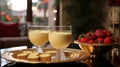 Delicious eggnog with cinnamon and nutmeg for the winter holidays. Traditional drink in glass, Christmas atmosphere.