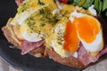 Delicious eggs benedict with spinach and ham on a toast Royalty Free Stock Photo