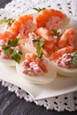 Delicious eggs stuffed with seafood close up on the table. vertical Royalty Free Stock Photo