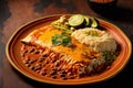 Delicious enchilada on plate with rice beans and peppers