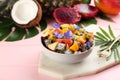 Delicious exotic fruit salad served on pink wooden table Royalty Free Stock Photo