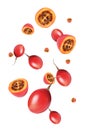 Delicious exotic tamarillo fruits flying on white background