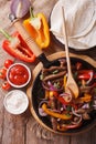 Delicious fajitas on a table in a rustic style. vertical top vie