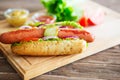 Delicious fast food. Hot dog with grilled sausages, onions and vegetables. Royalty Free Stock Photo
