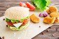 Delicious fast food. Top view bbq hamburger on the wooden background. Royalty Free Stock Photo