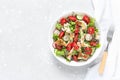 Delicious Fattoush or Arab salad with pita bread, fresh vegetables on plate. Middle Eastern bread salad. Top view