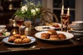 A delicious and festive Hanukkah table spread with latkes, challah bread, and other traditional dishes, ready to be