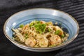 Delicious fettuccine pasta with shrimp and parsley - Dark background