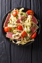 Delicious fettuccine pasta with tuna steak, tomatoes and capers Royalty Free Stock Photo