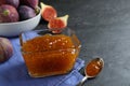 Delicious fig jam in glass bowl on black table, closeup Royalty Free Stock Photo