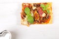Delicious fig, mozzarella and ham pizza one piece Royalty Free Stock Photo