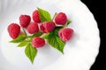 Delicious first class fresh raspberries in plate Royalty Free Stock Photo