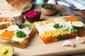 Delicious fish aspic served on wooden board closeup