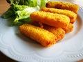 Delicious fish fingers on white plate - perspective view. Royalty Free Stock Photo