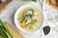 Delicious fish soup served on white wooden table Royalty Free Stock Photo