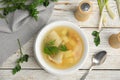 Delicious fish soup served on white wooden table Royalty Free Stock Photo
