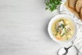 Delicious fish soup served on white wooden table. Space for text Royalty Free Stock Photo