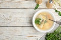 Delicious fish soup served on white wooden table. Space for text Royalty Free Stock Photo