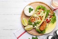 Delicious fish tacos served on white wooden table, flat lay Royalty Free Stock Photo