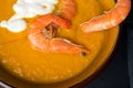 Delicious flavored pumpkin soup with shrimps. Close-up. The aroma of autumn