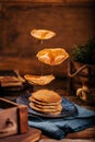 delicious flying american pancakes with flowing mapple syrup