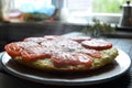 Delicious fragrant pizza on a plate with zucchini, tomatoes and cheese Royalty Free Stock Photo