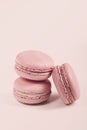 Delicious french dessert. Three gentle soft pink purple cakes macaron or macaroon