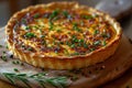 a delicious french quiche lorraine on a wooden plate