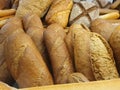 Delicious and fresh bread.  The flavored bread is baked in the bakery and placed on the shelf for sale. Royalty Free Stock Photo